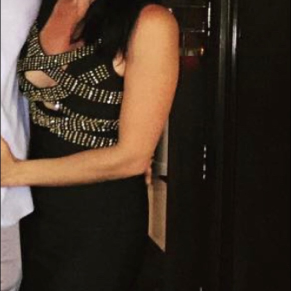 Bandage black dress with gold and diamond details.